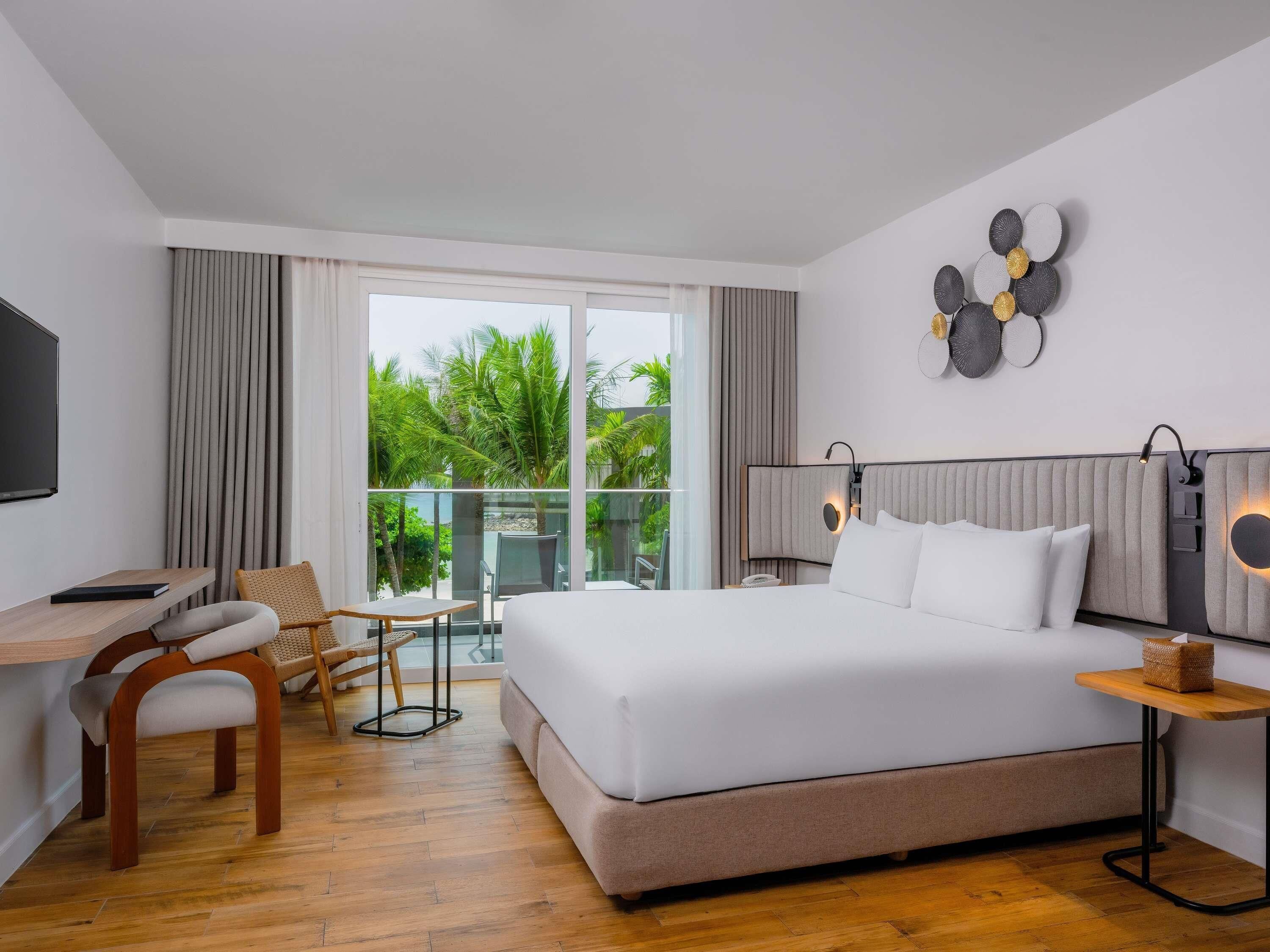 Superior Ocean Side (Garden View) | Minibar, in-room safe, desk, laptop workspace
