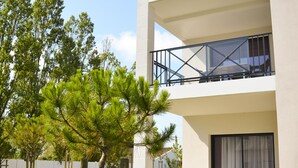 A modern two-story building with a balcony on the upper floor. - Adonis La Baule (La Baule-Escoublac)