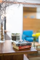 A wooden table with two books titled 'James Patterson' and 'The Moores Are Missing'.