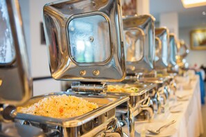 A buffet setup with multiple serving stations.