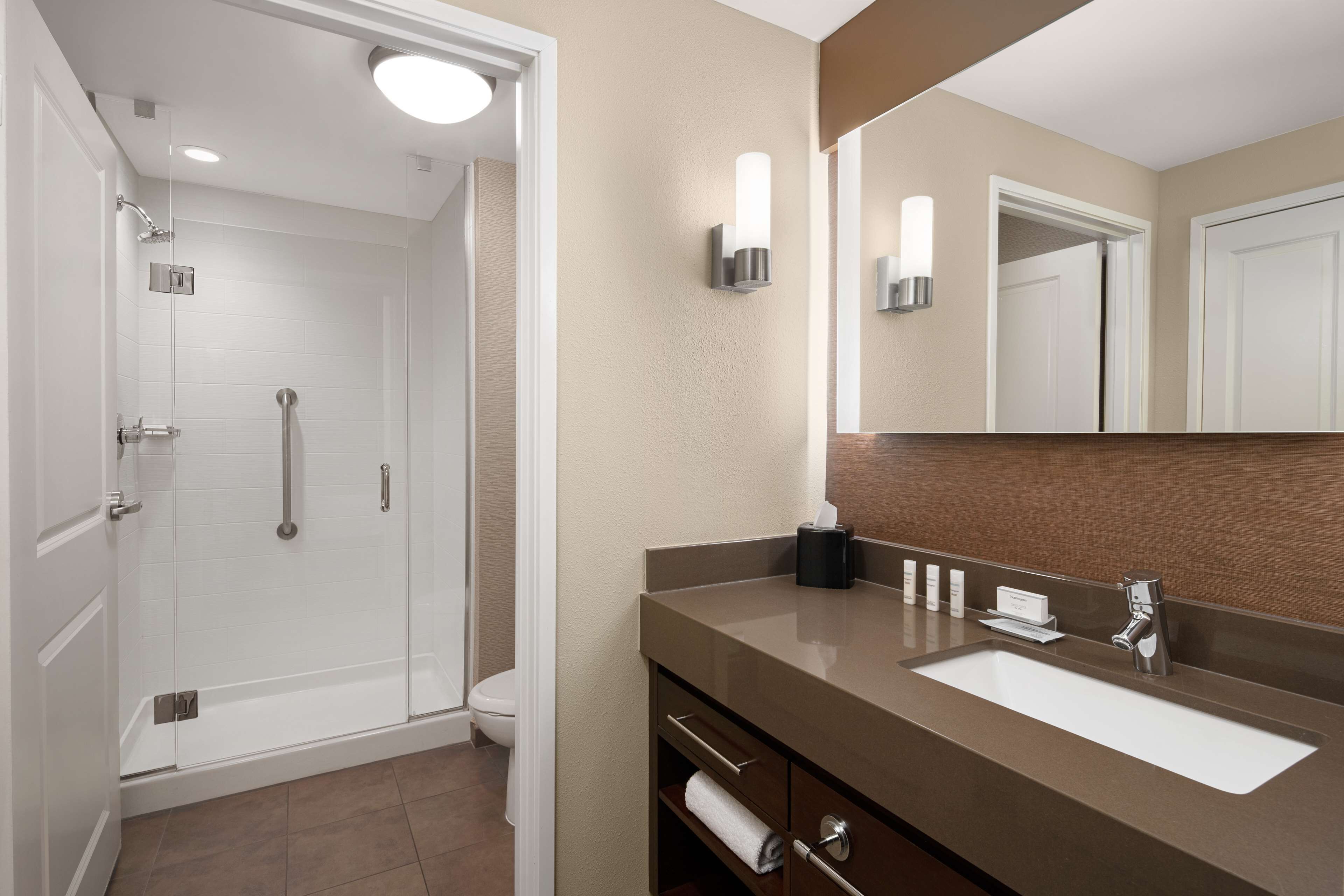 designer toiletries, hair dryer, towels, soap