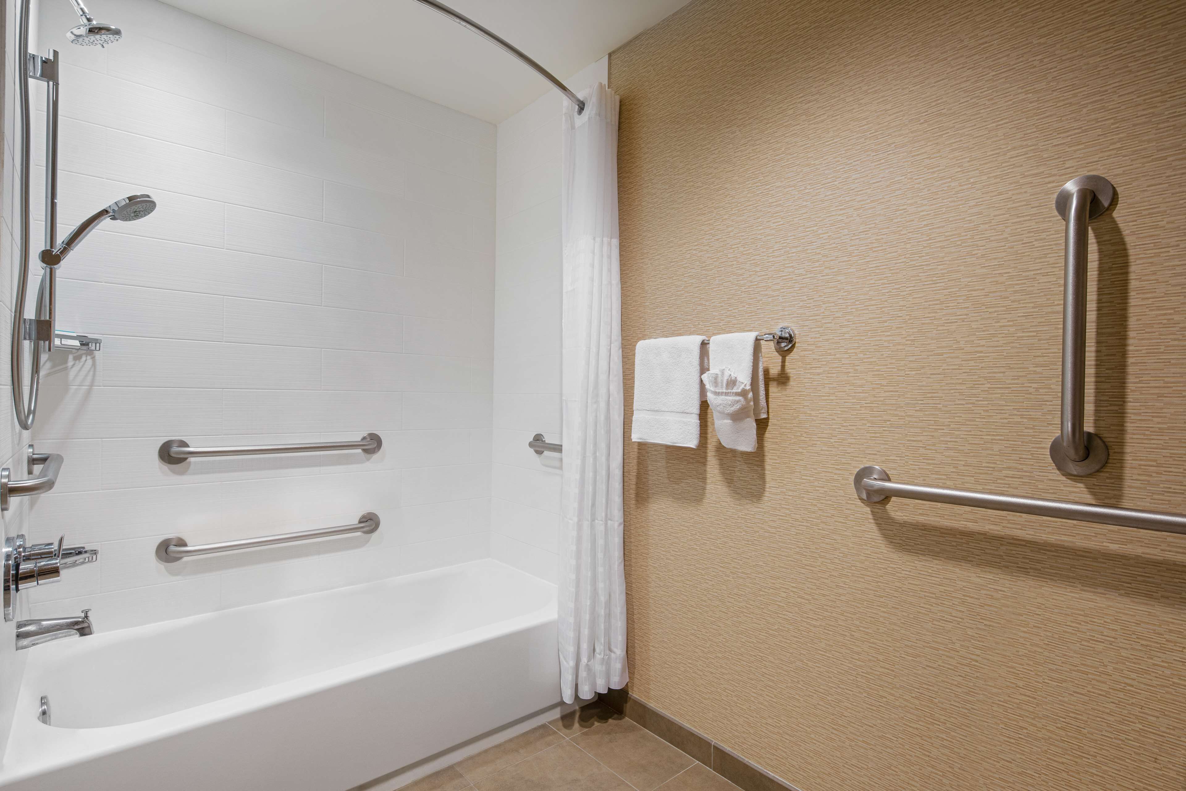 studio, one king bed, accessible | bathroom | designer toiletries, hair dryer, towels, soap