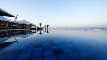 Breakfast, lunch, dinner served; international cuisine, pool views