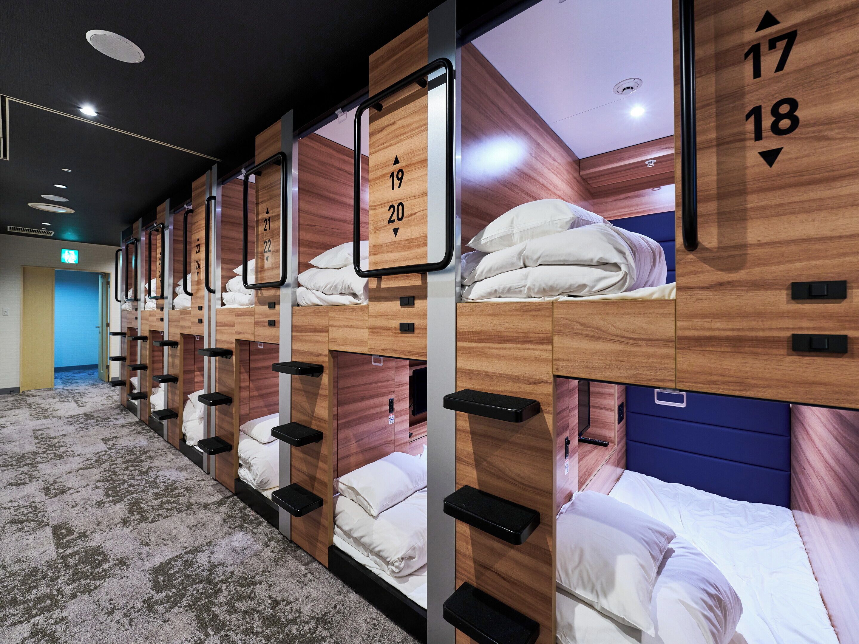 A hotel room with bunk beds, each marked with a number.