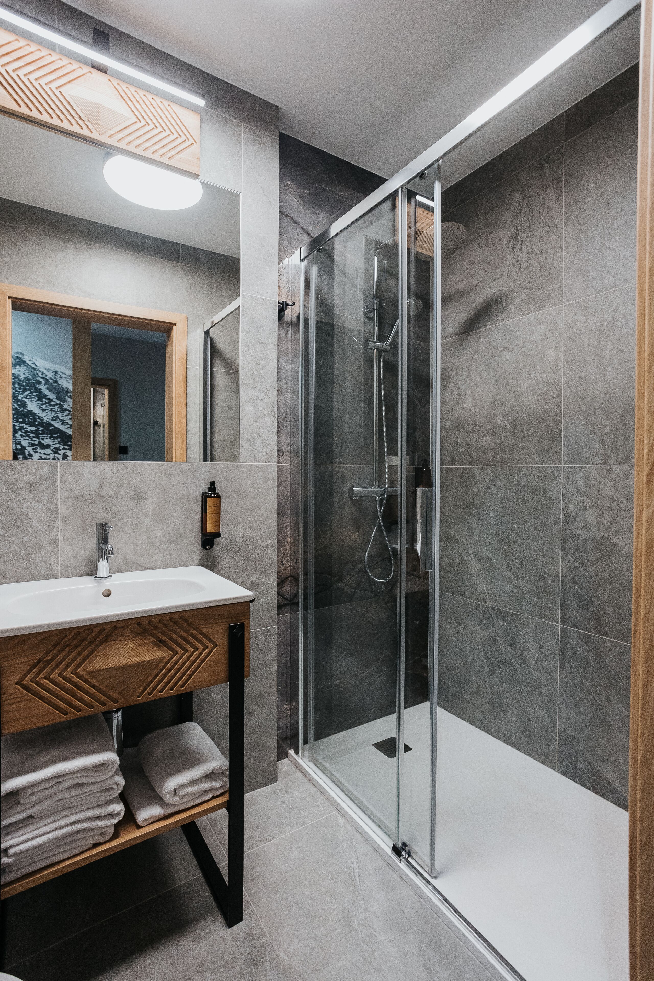 deluxe apartment, 2 bedrooms, kitchenette, mountain view | bathroom | hair dryer, heated floors, towels, soap