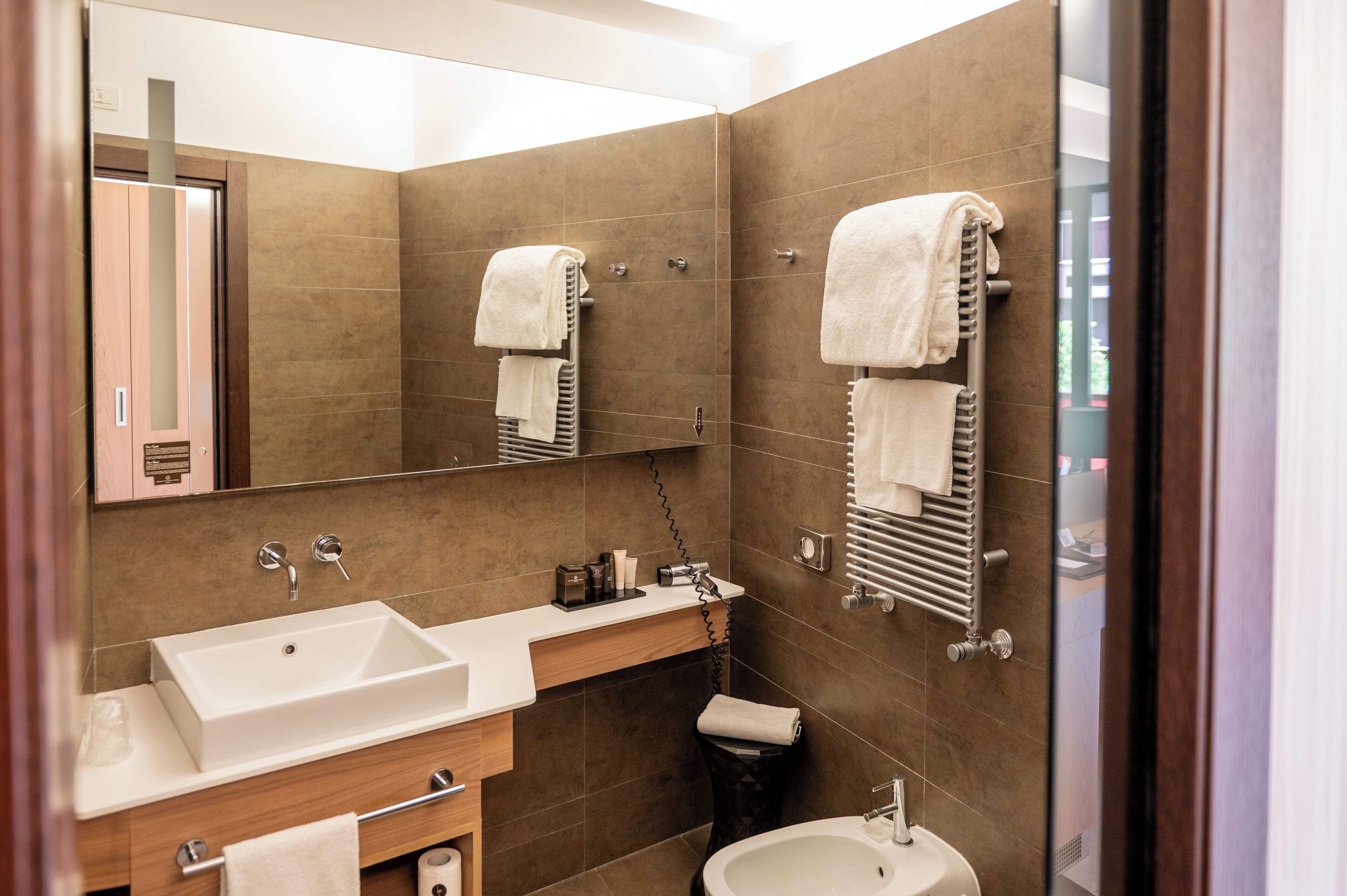 free toiletries, hair dryer, bidet, towels