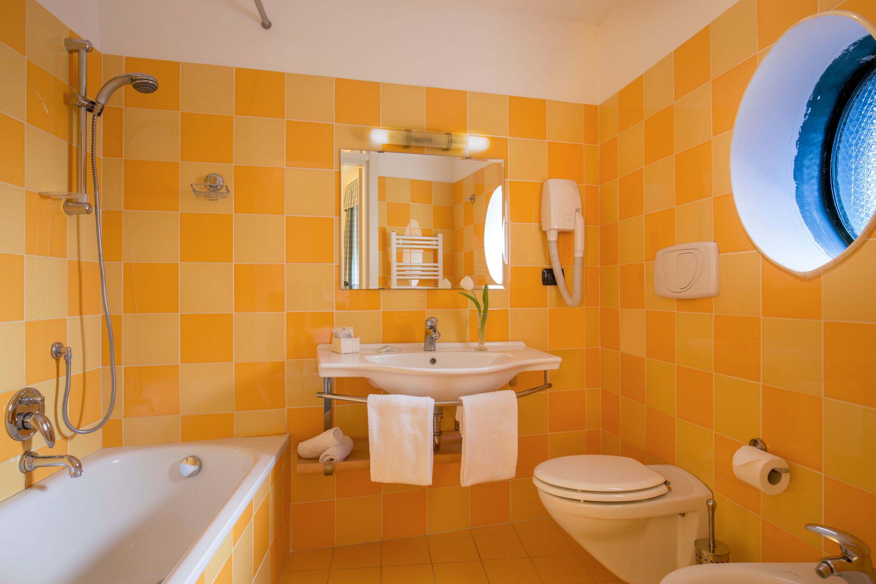 deep-soaking bathtub, rainfall showerhead, free toiletries, hair dryer