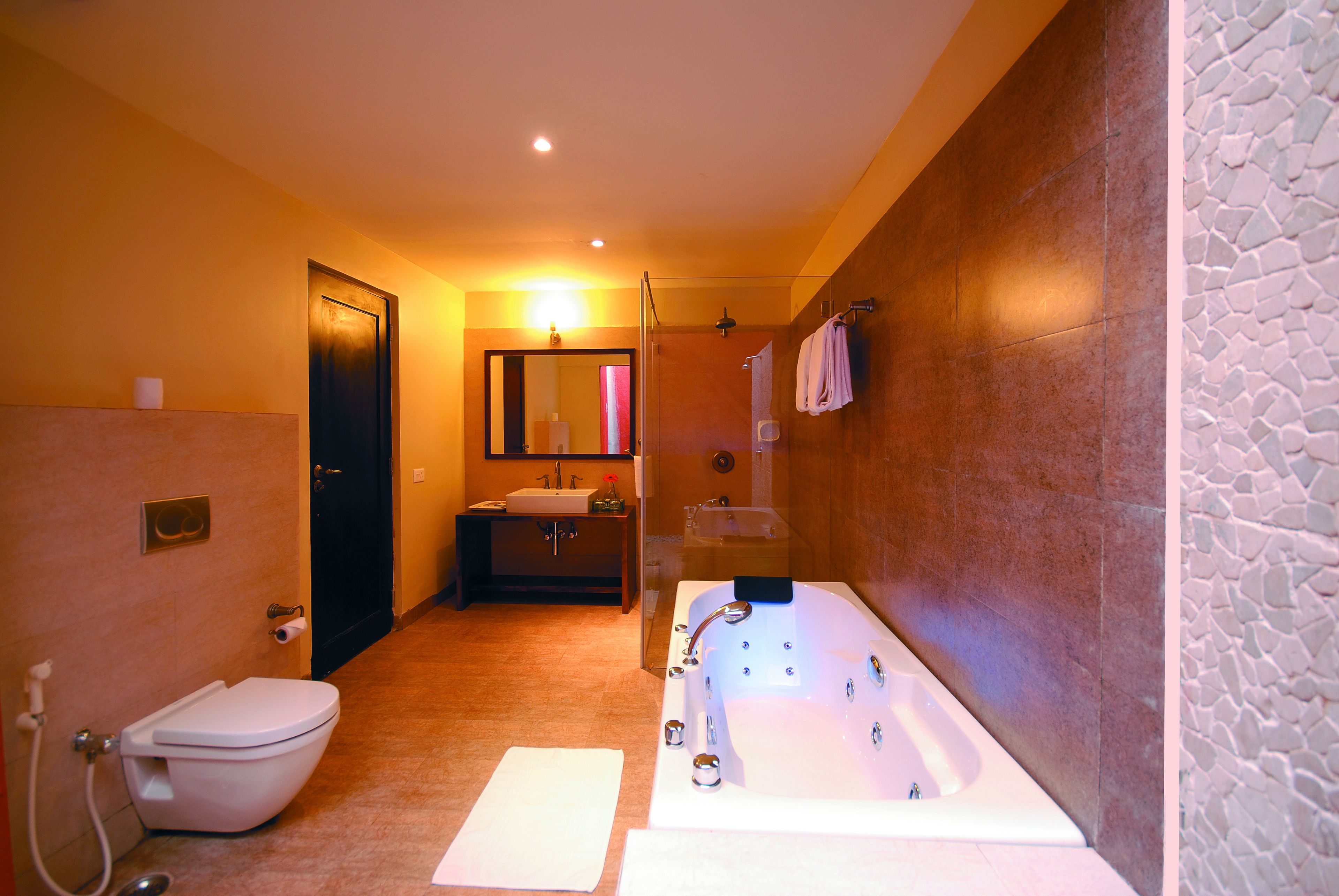 studio suite | bathroom | designer toiletries, hair dryer, slippers, towels