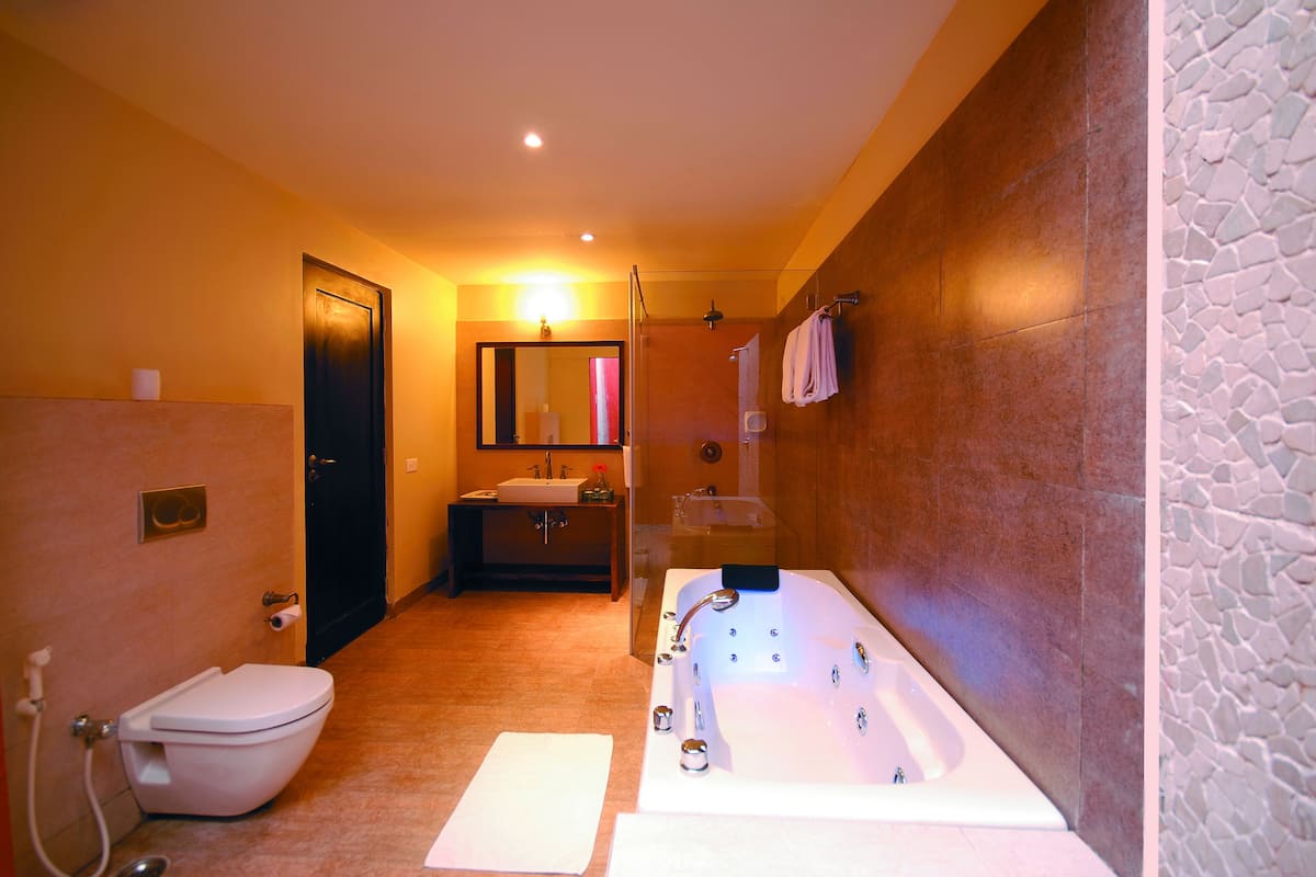 studio suite | bathroom | designer toiletries, hair dryer, slippers, towels