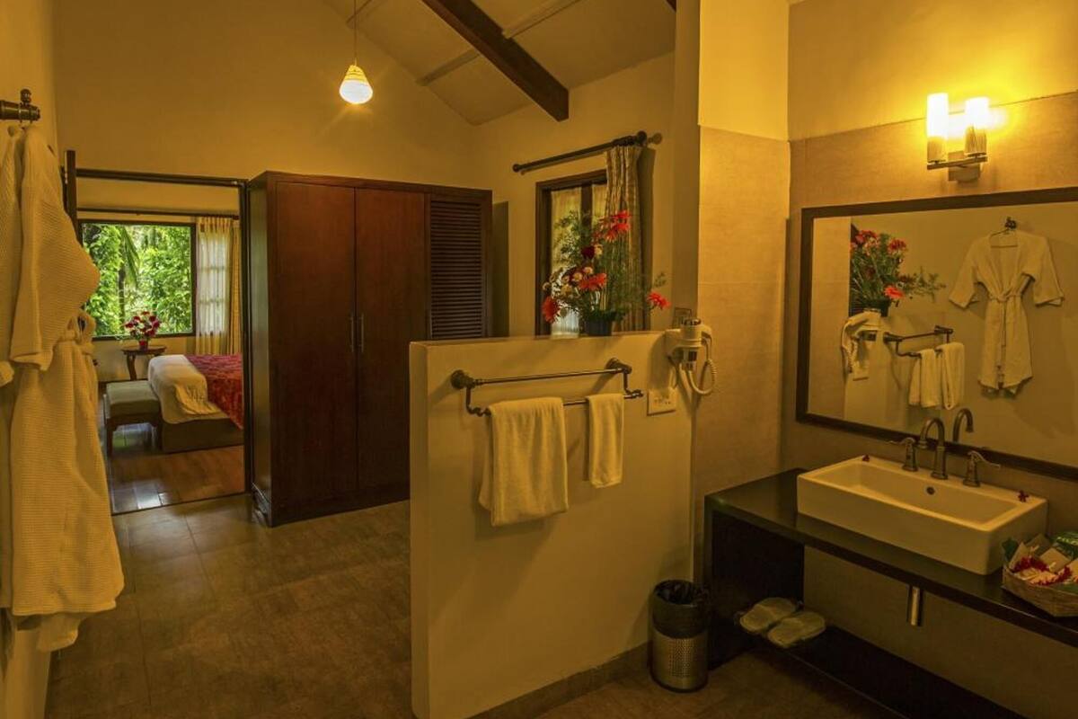 designer toiletries, hair dryer, slippers, towels