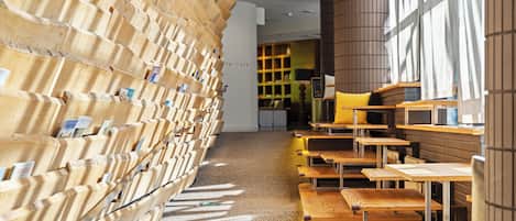 A library with bookshelves and tables.