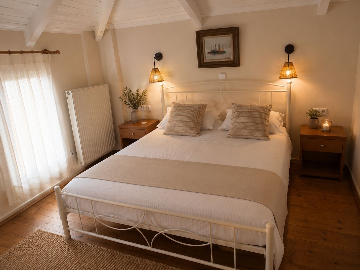A bedroom with a bed, two bedside lamps, a nightstand with a plant, and a framed picture on the wall.