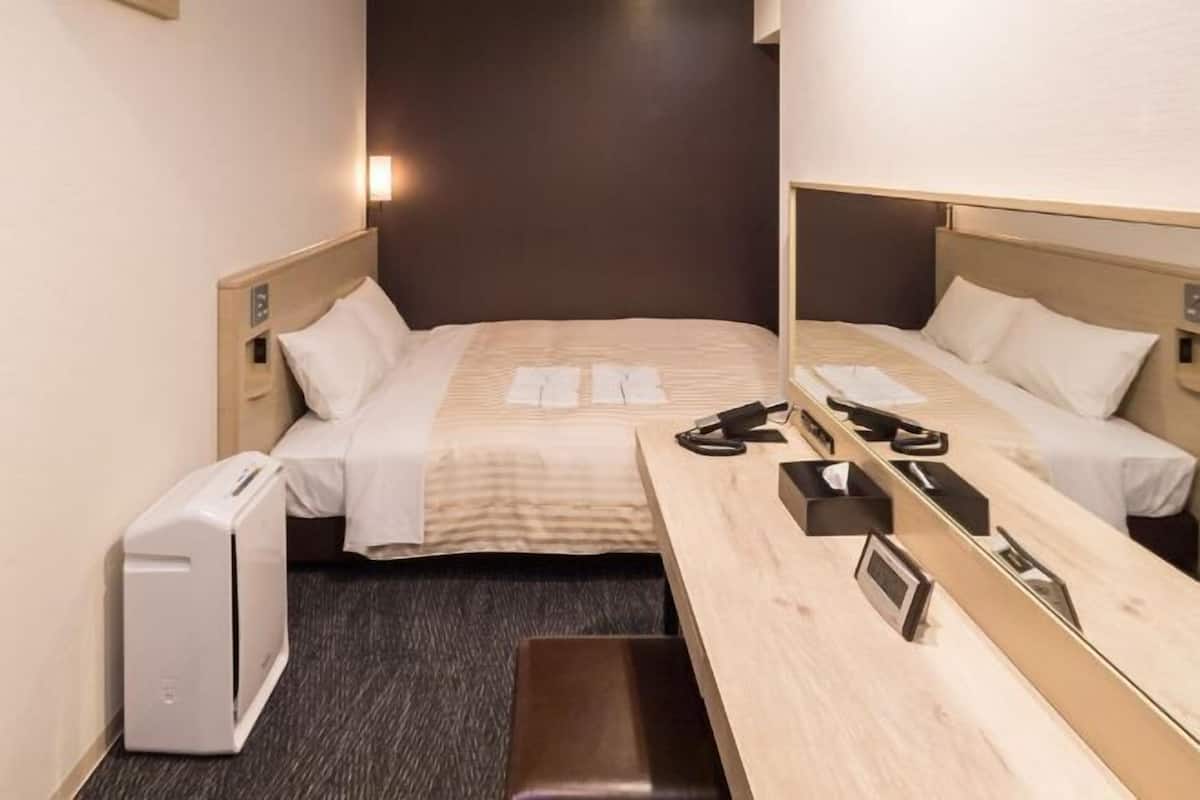 Down duvets, laptop workspace, blackout curtains, iron/ironing board