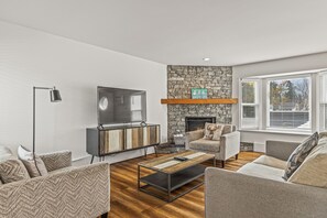 Apartment, 3 Bedrooms, Mountain View (Self Check In, No Pets) | Living area | 50-inch flat-screen TV with cable channels, TV - Lamphouse By Basecamp (Canmore)