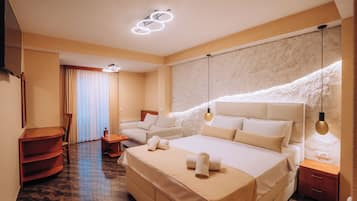 Deluxe Triple Room, 1 Bedroom, Garden View | 1 bedroom, minibar, individually decorated, blackout curtains