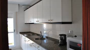 Standard Apartment, 2 Bedrooms | Private kitchenette | Full-sized fridge, microwave, stovetop, coffee/tea maker