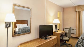 Enjoy a comfortable stay in this well-appointed room featuring a flat-screen TV, a desk, and a large mirror.