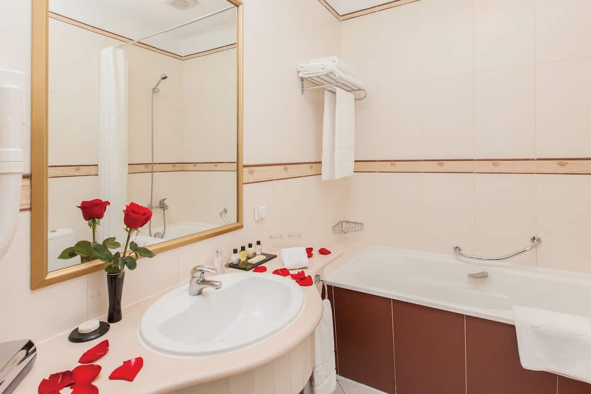 deluxe double room | living area | 100-cm smart tv with satellite channels