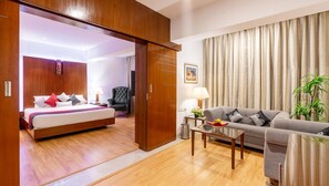Minibar, in-room safe, desk, laptop workspace - SFO Hotel and Suites (Bengaluru)