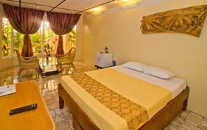 King Room | Minibar, in-room safe, individually decorated, desk - Deep Forest Garden Hotel (Puerto Princesa)