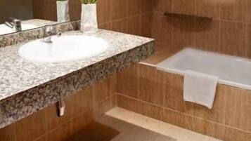 Apartment, 1 Bedroom | Bathroom | Bathtub, deep soaking tub, free toiletries, hair dryer