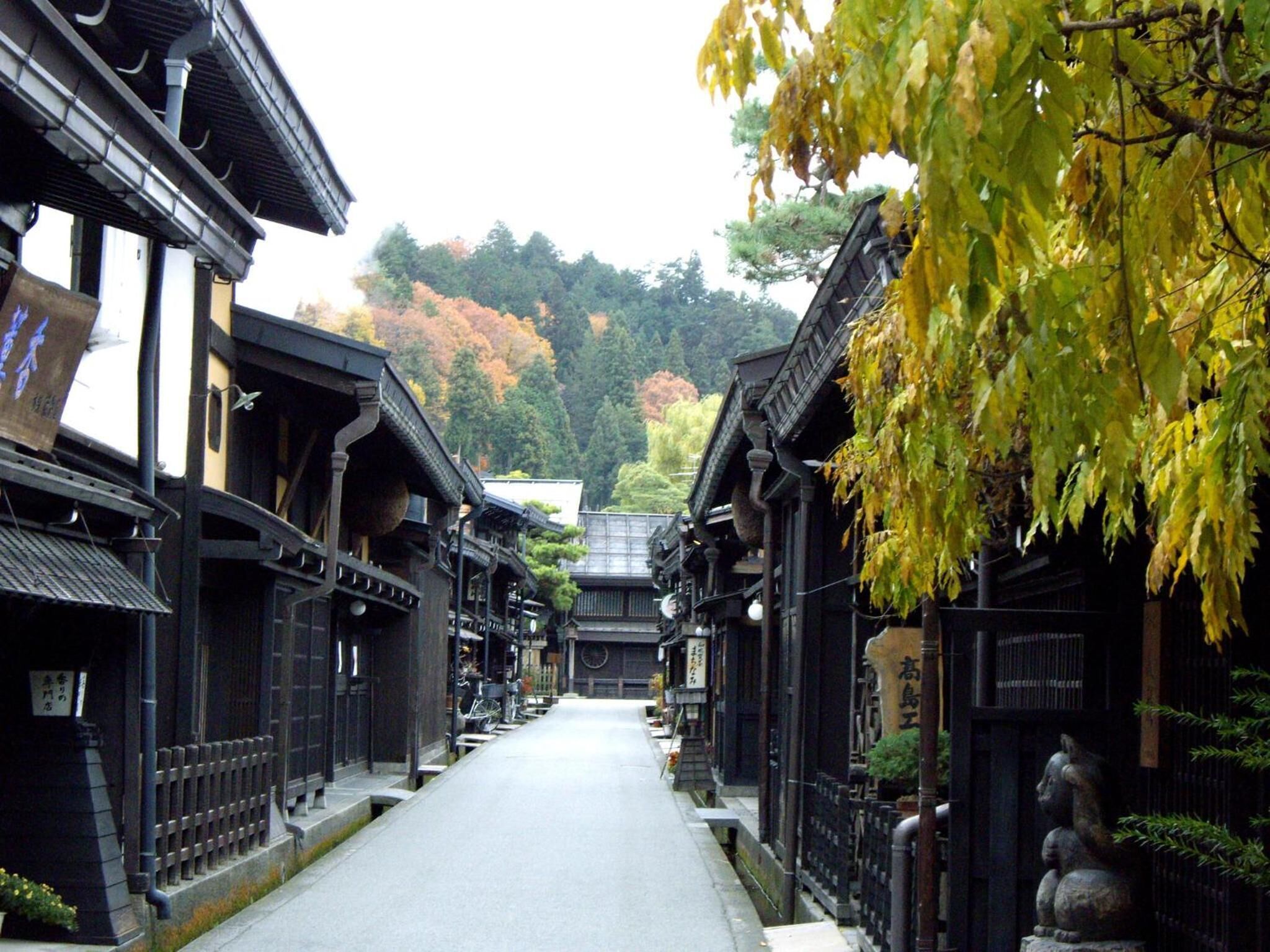 A traditional Japanese street with wooden buildings and a clear path.