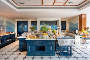 A spacious kitchen with a central island, equipped with various appliances and a coffee station. - Radisson Resort Pondicherry Bay (Puducherry)
