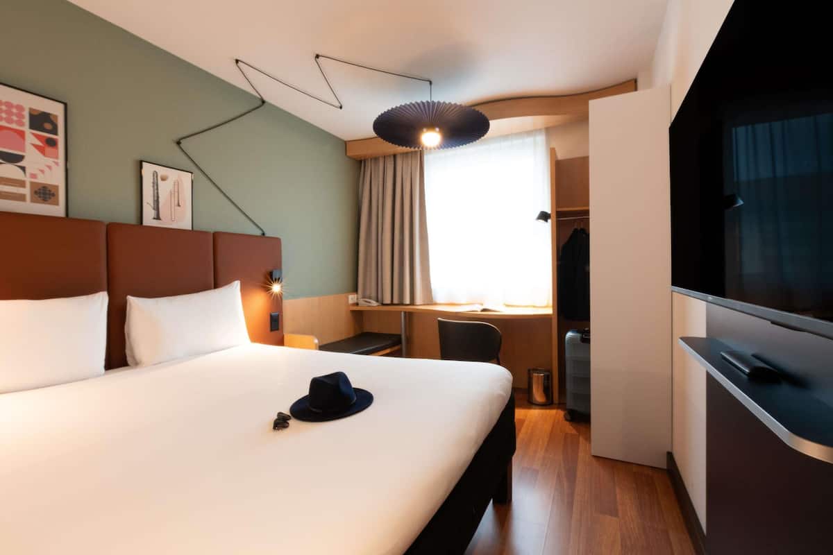 Premium bedding, pillow-top beds, desk, laptop workspace