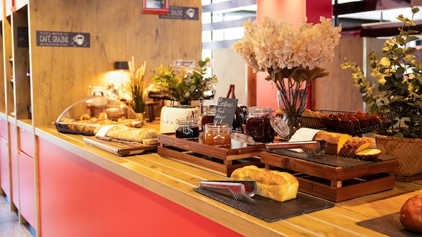 A breakfast buffet with various pastries, bread, and jams. - ibis Geneve Centre Nations (Geneva)