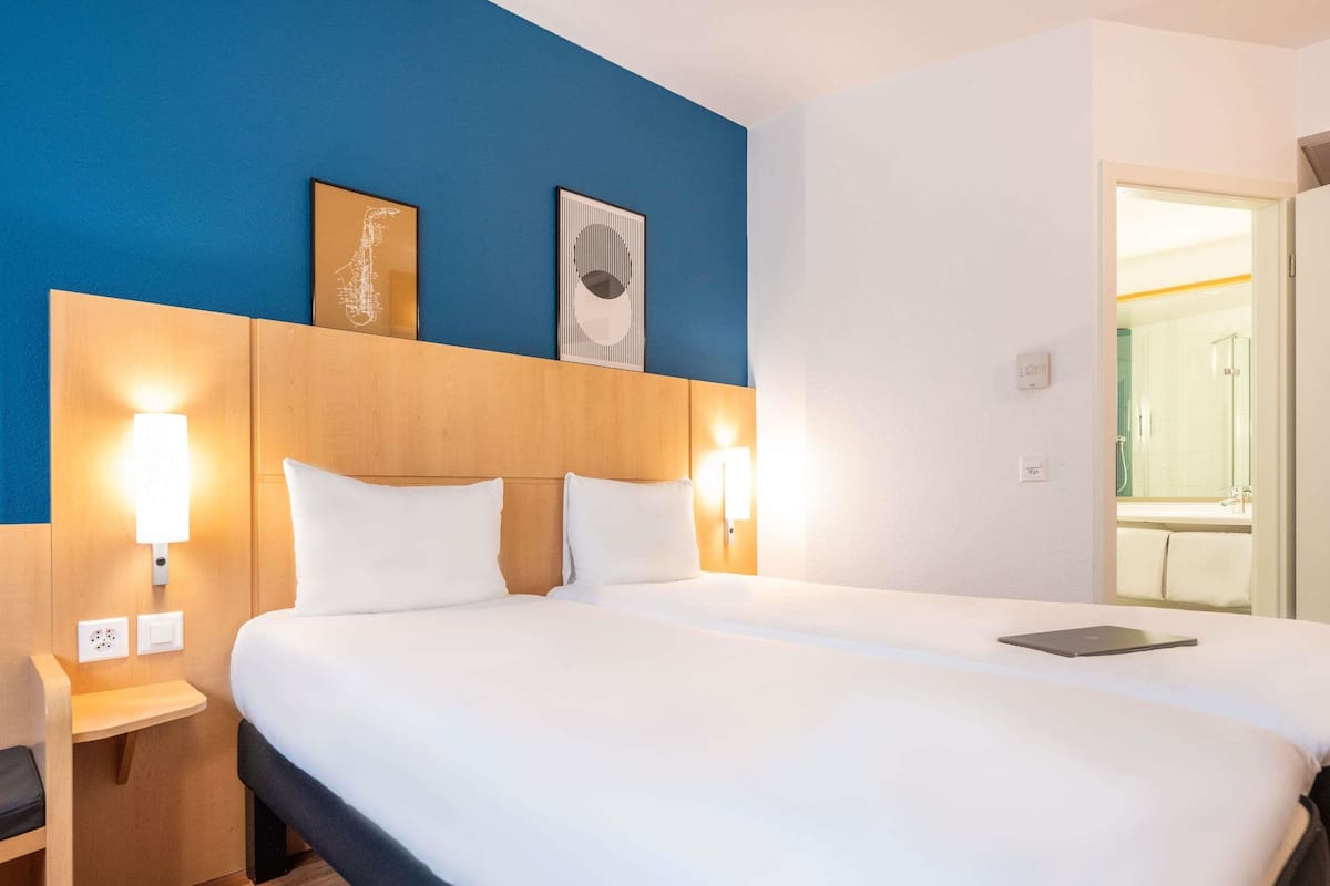 Premium bedding, pillow-top beds, desk, laptop workspace