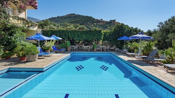 Outdoor pool, pool umbrellas, pool loungers