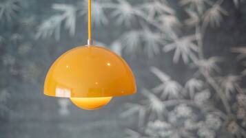 A hanging orange pendant light fixture.