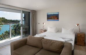 Premium bedding, laptop workspace, blackout drapes, soundproofing