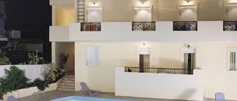 Seasonal outdoor pool, pool umbrellas, pool loungers