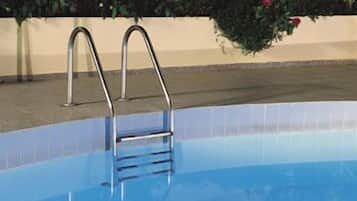 Seasonal outdoor pool, pool umbrellas, sun loungers