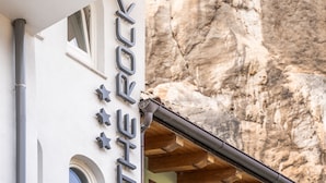 A building with a sign reading "ON THE ROCK" and a balcony with metal railings. - Garnì On The Rock (Arco)