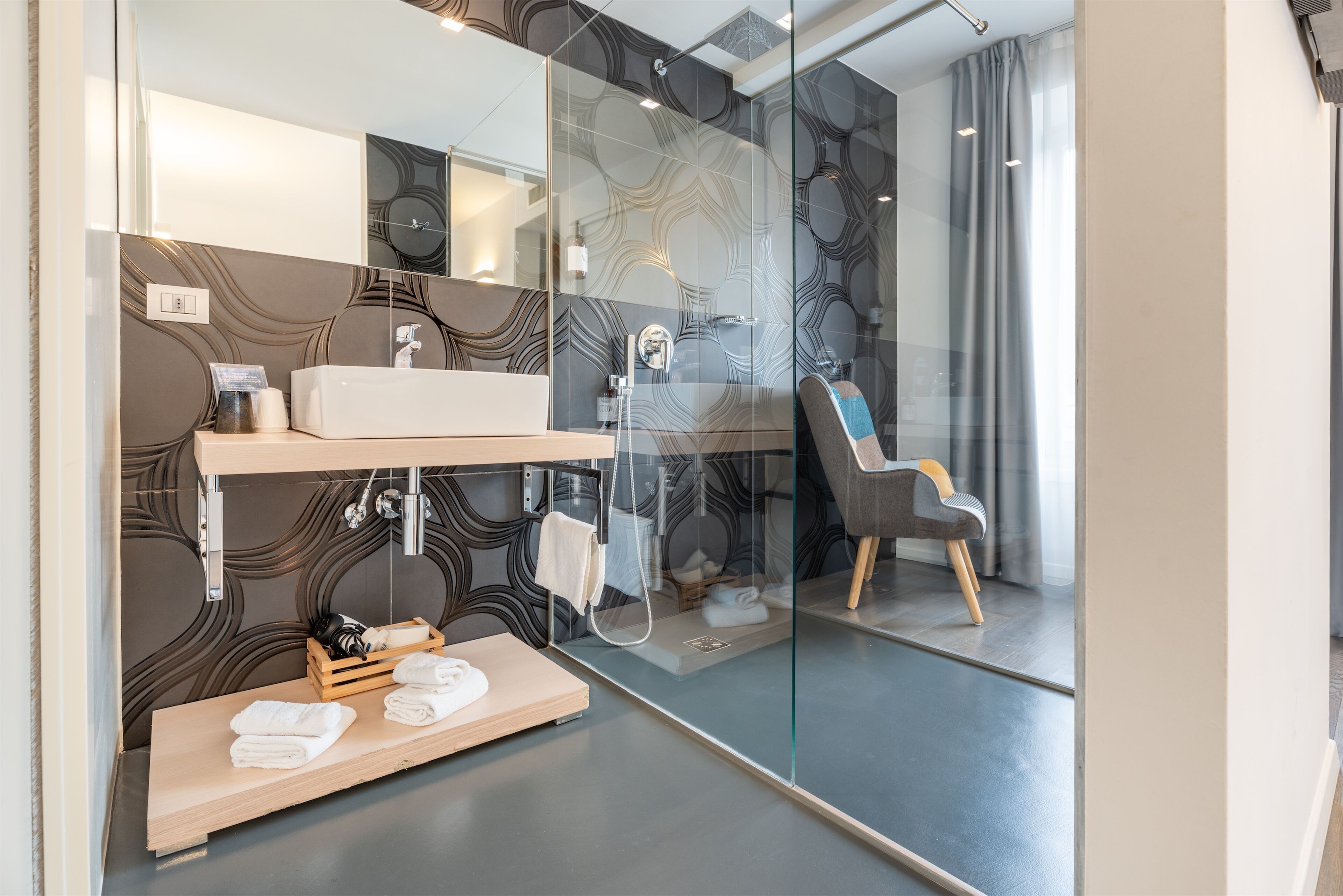 deluxe double room | bathroom | shower, hair dryer, towels