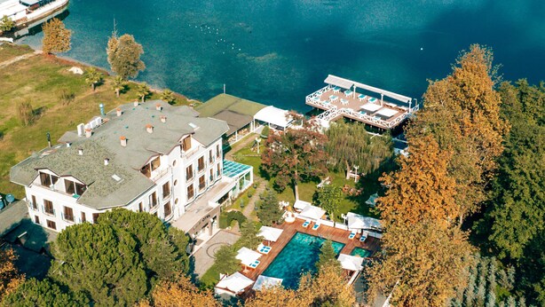 An aerial view of a large property with a swimming pool, multiple buildings, and a dock. - Lale Boutique Hotel (Sapanca)