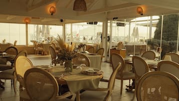 Breakfast, lunch, dinner served; international cuisine, beach views