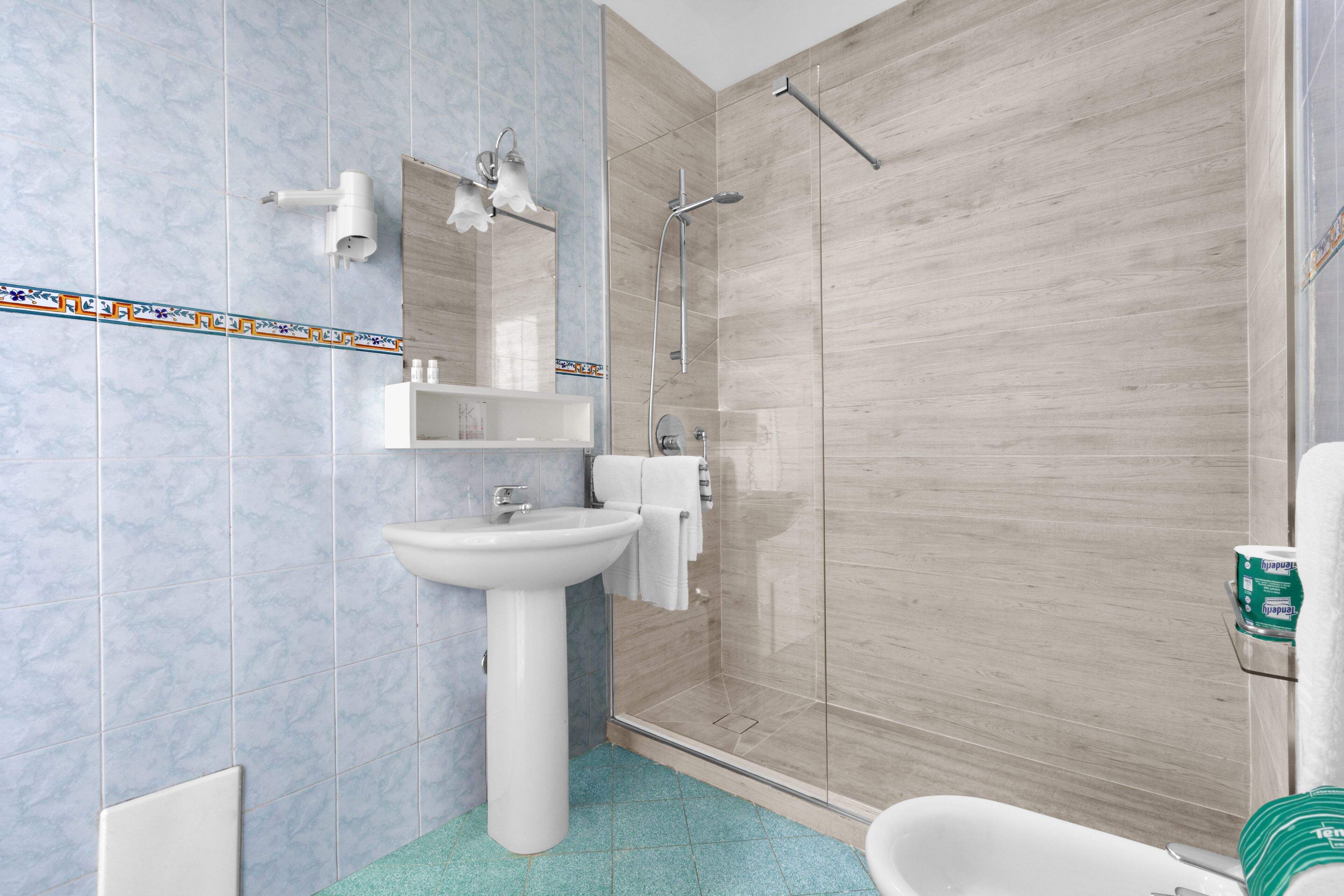 free toiletries, hair dryer, bidet, towels