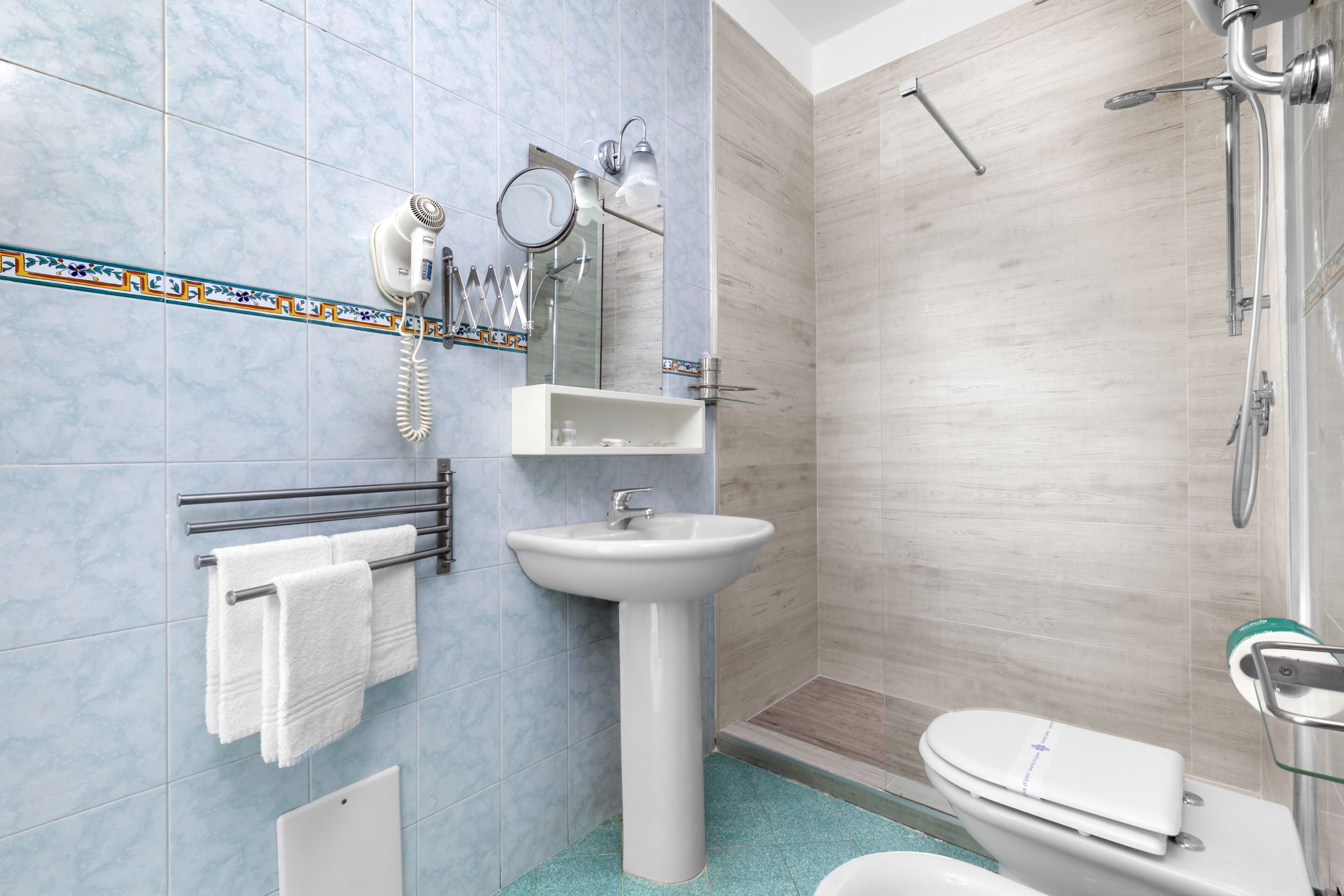superior triple room | bathroom | free toiletries, hair dryer, bidet, towels