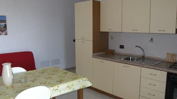Apartment, 1 Bedroom, Sea View (for 2 people) | Living area | 28-inch flat-screen TV with digital channels, TV