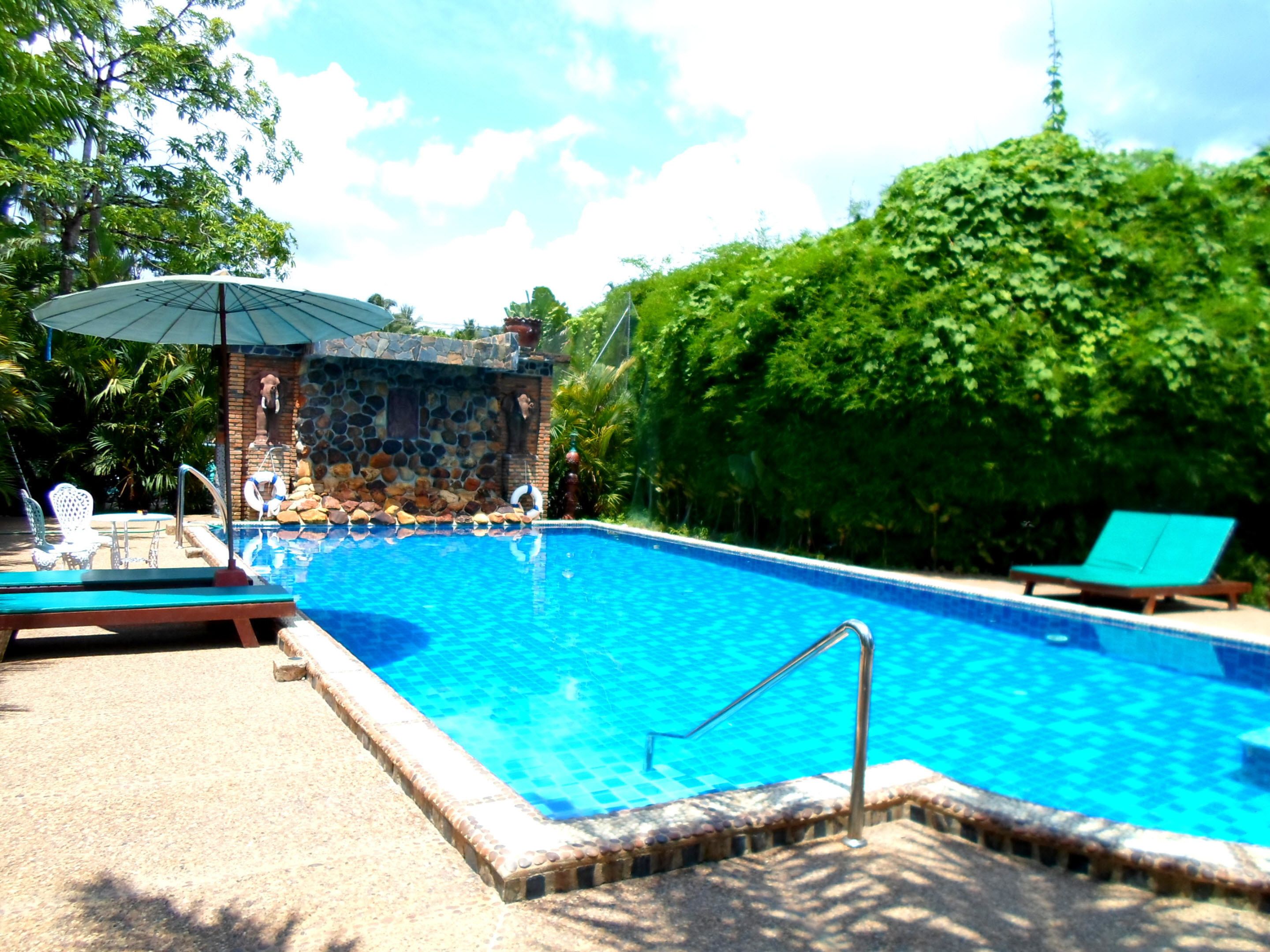 outdoor pool, pool umbrellas, pool loungers