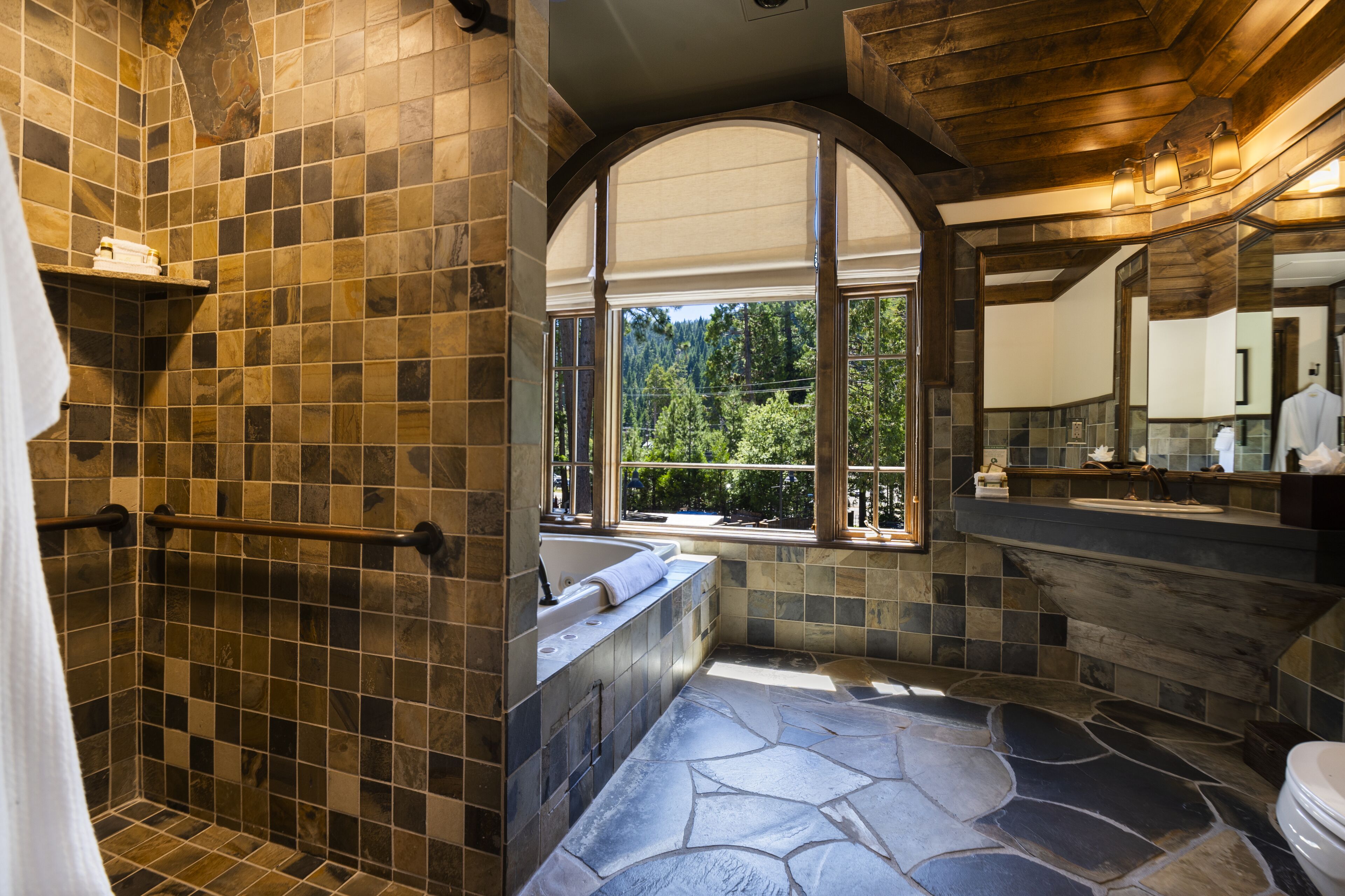 mckinney suite, king bed with mountain view | bathroom | combined shower/bathtub, free toiletries, hair dryer, towels