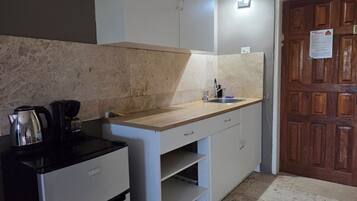 Fridge, microwave, stovetop, coffee/tea maker