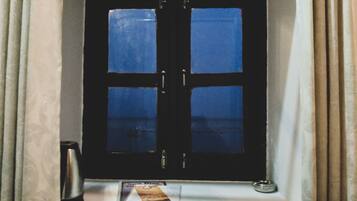 A window with a black frame and four glass panes.