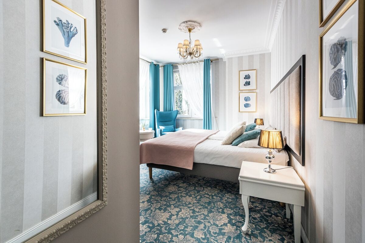 Select Comfort beds, free minibar items, in-room safe, desk