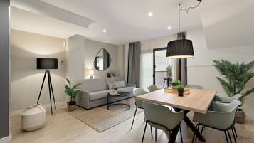 City Duplex | Living area | 42-inch flat-screen TV with digital channels, TV