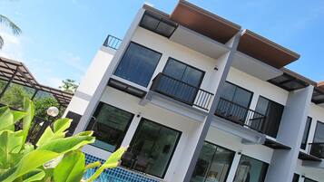 Deluxe Room, Pool Access | In-room safe, individually decorated, individually furnished, desk