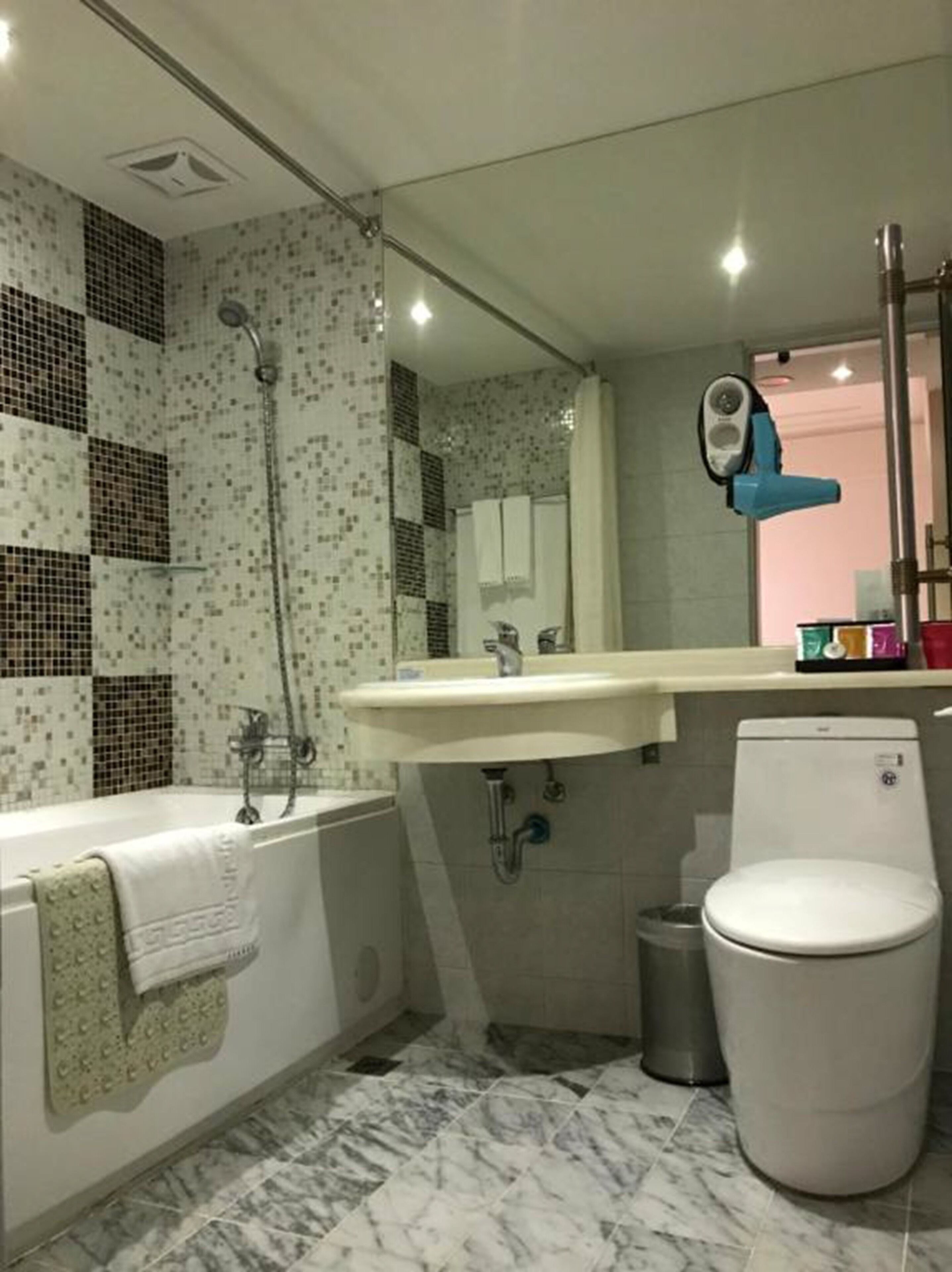 standard double room | bathroom | hair dryer, slippers, towels, shampoo